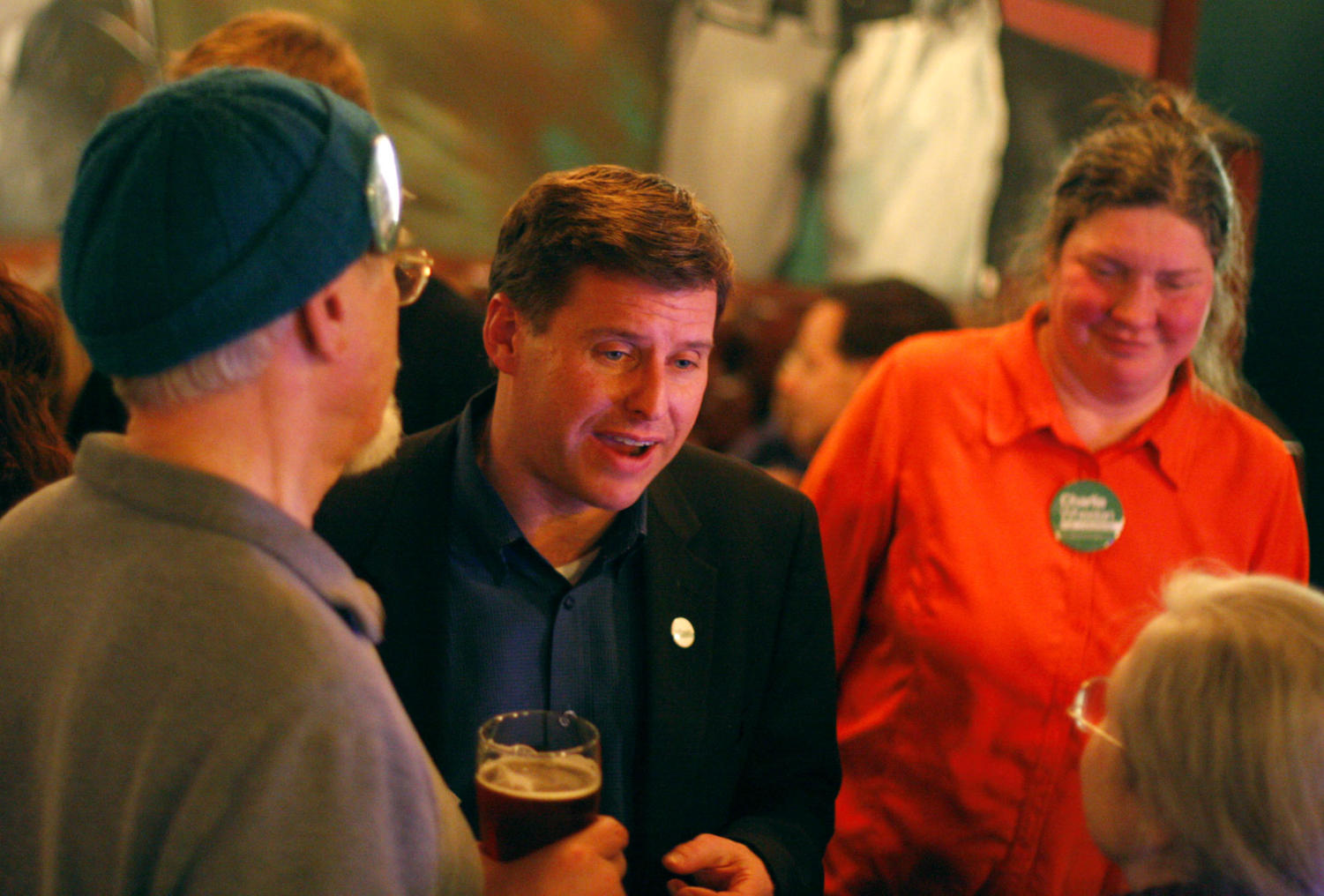 Charles Wheelan, professor at the Harris School of Public Policy, speaks with three supporters on the night of Illinois's 5th Congressional District Democratic primary Tuesday. Later in the night, Wheelan conceded the election at the Goose Island Brewery in front of family, friends, and supporters.
