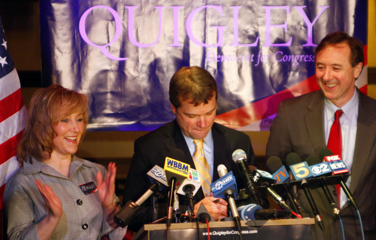 Mike Quigley (center) gives his victory speech for Illinois's 5th Congressional District Democrat primary, alongside his wife Barbara and Forrest Claypool, Cook Country Commissioner of the 12th District, Tuesday night at Red Ivy in Wrigleyville.