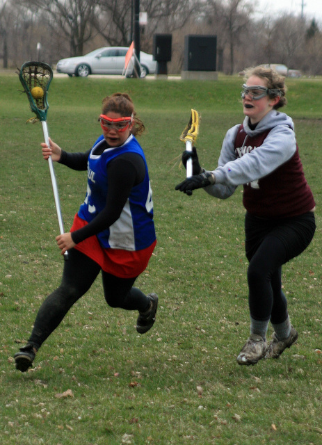 Marley Turner (right), fourth-year, chases after opponent during the women's lacrosse home tournament last Sunday at the Midway Plaisance.  The team won two of their three games that day.