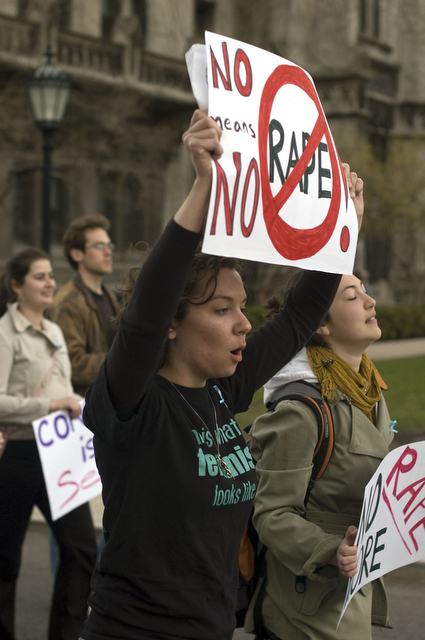 Ursula Wagner, a first-year at the School of Social Service Administration, marches on the main quad during the Take Back the Night rally last Thursday.