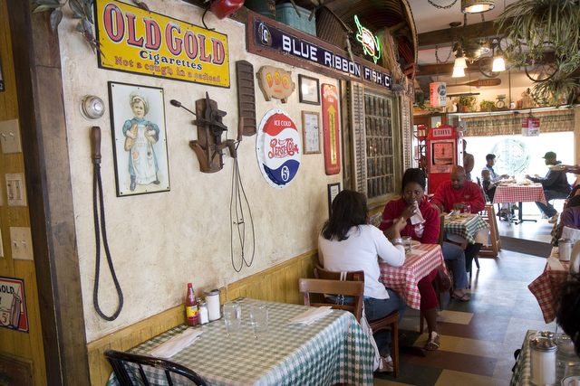 The restaurant's interior features bait shop memorabilia. Some of the restaurant's most popular dishes are Southern-style entrees, such as blackened catfish.