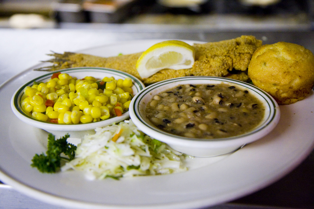The signature dish at Dixie Kitchen is whole baby catfish, deep fried, and prepared with a side of corn and black eyed peas.  After it closes, the restaurant's most popular dishes will be served at Calypso Cafe.