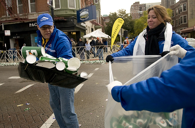 A clean-up crew shovels cups off of the marathon course in Boystown. The 2009 Chicago Marathon took place on a cold and rainy Sunday. Runners followed a route from Grant Park all around the city.