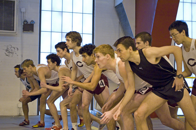 Runners await the gun during the Men's mile race at the indoor track and field meet on Saturday.