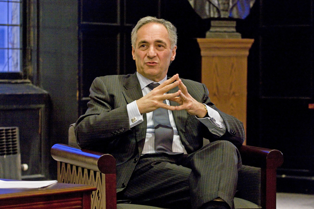 President Zimmer sitting in the McCormick Tribune Lounge listening to a students' question at the Quarterly Open Student Meeting with President Zimmer and Vice President Kimberly Goff-Crews on Tuesday in McCormick Lounge.