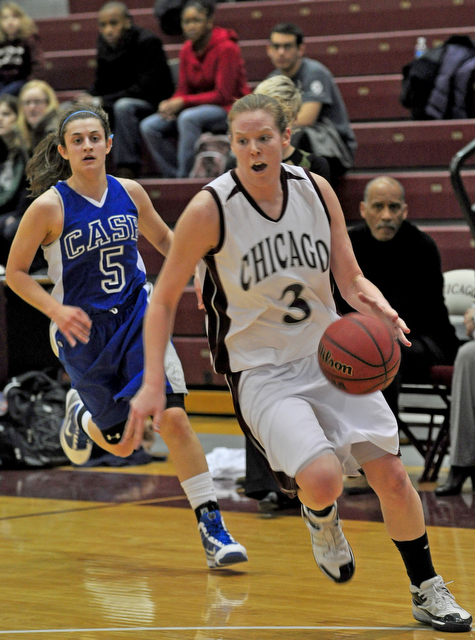 Fourth-year guard Micaela White drives toward the hoop during the home game against Case on Sunday, which ended in a 58-57 win for the Maroons.