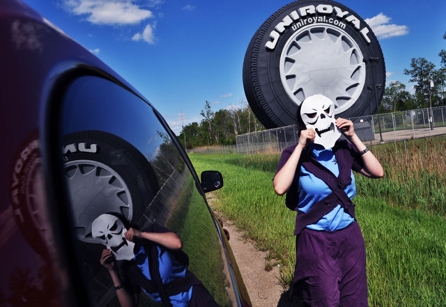 Third-year Christina Daly, dressed as Skeletor, prepares to complete a road trip item (no. 93) for the Max P. Scav team on I-90.