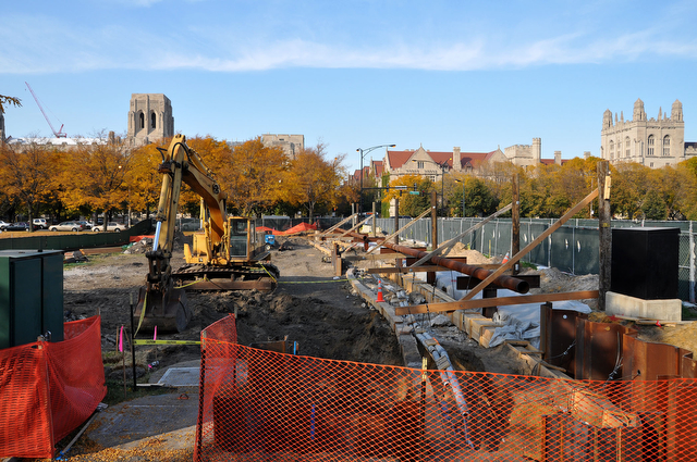 Backhoes gouge the soil at the Midway just west of Ellis Avenue as part of the Midway Crossings construction project.