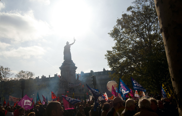 Protesters riot near the central statue at the Place de la Republique last Thursday, two days after the Senate passed the retirement bill.