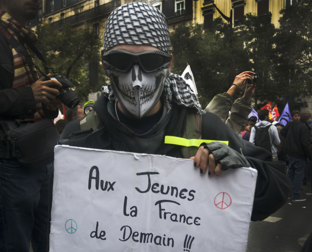 Student rioter protests against the reform at a riot near the Place d'Italie in Paris in early October. High school students traditionally play a large role in the French riots.