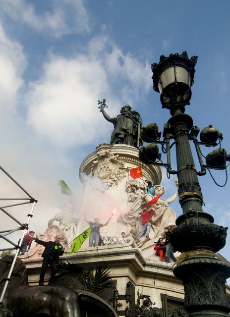 Protesters riot on the central statue at the Place de la Republique last Thursday, two days after the Senate passed the retirement bill.