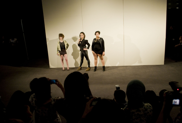 First-year Zoe Steinberg (left), third-year Steffi Carter (middle), and second-year Cassandra Walker model designs sold by Akira at the MODA Spring 2011 Fashion Show at the Chicago Cultural Center Friday night.
