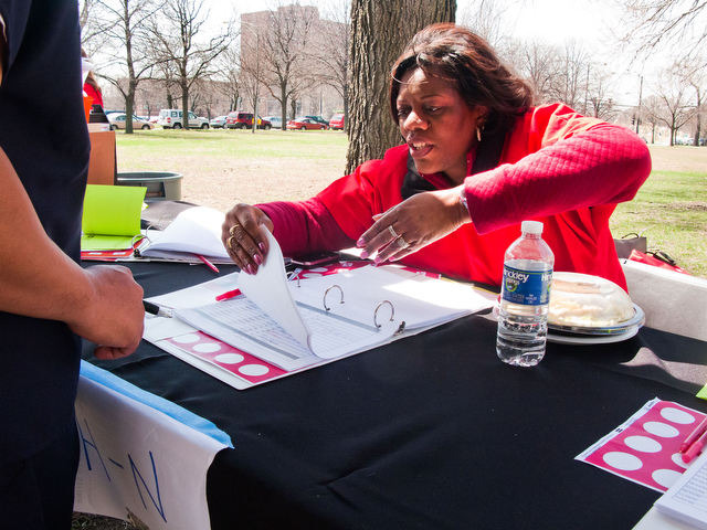 Brigitt Manson of National Nurses United gathers signatures from medical workers on Wednesday to support a strike.