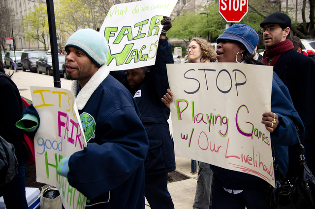 Housekeeping employees Tony Hoover (left) and Janeet Orange rallies with students and fellow workers Thursday afternoon outside the Admin building. Tony and Janeet both currently work at South Campus and have been working for the University for over ten years.