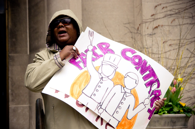 Mila Kuntu, a housekeeping employee at the Division of the Physical Sciences rallies with students and fellow workers Thursday afternoon outside the Admin building.