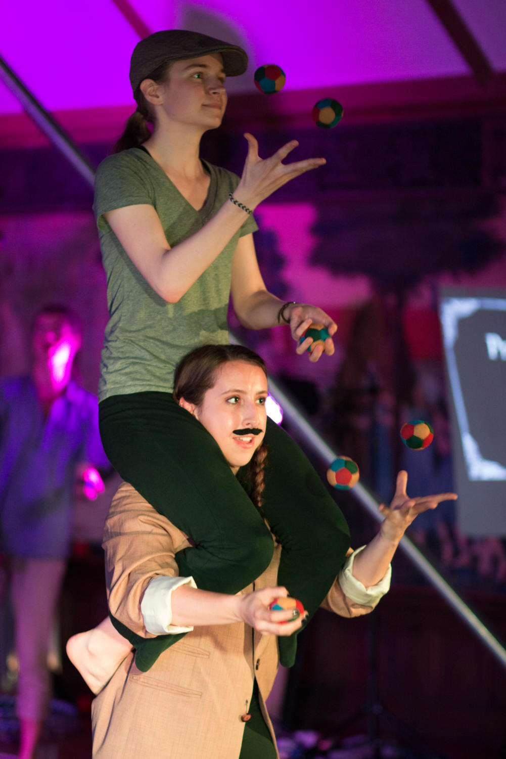 Gwennie Gilbert-Snyder and Cecilia Boyers combine partner acro and juggling.