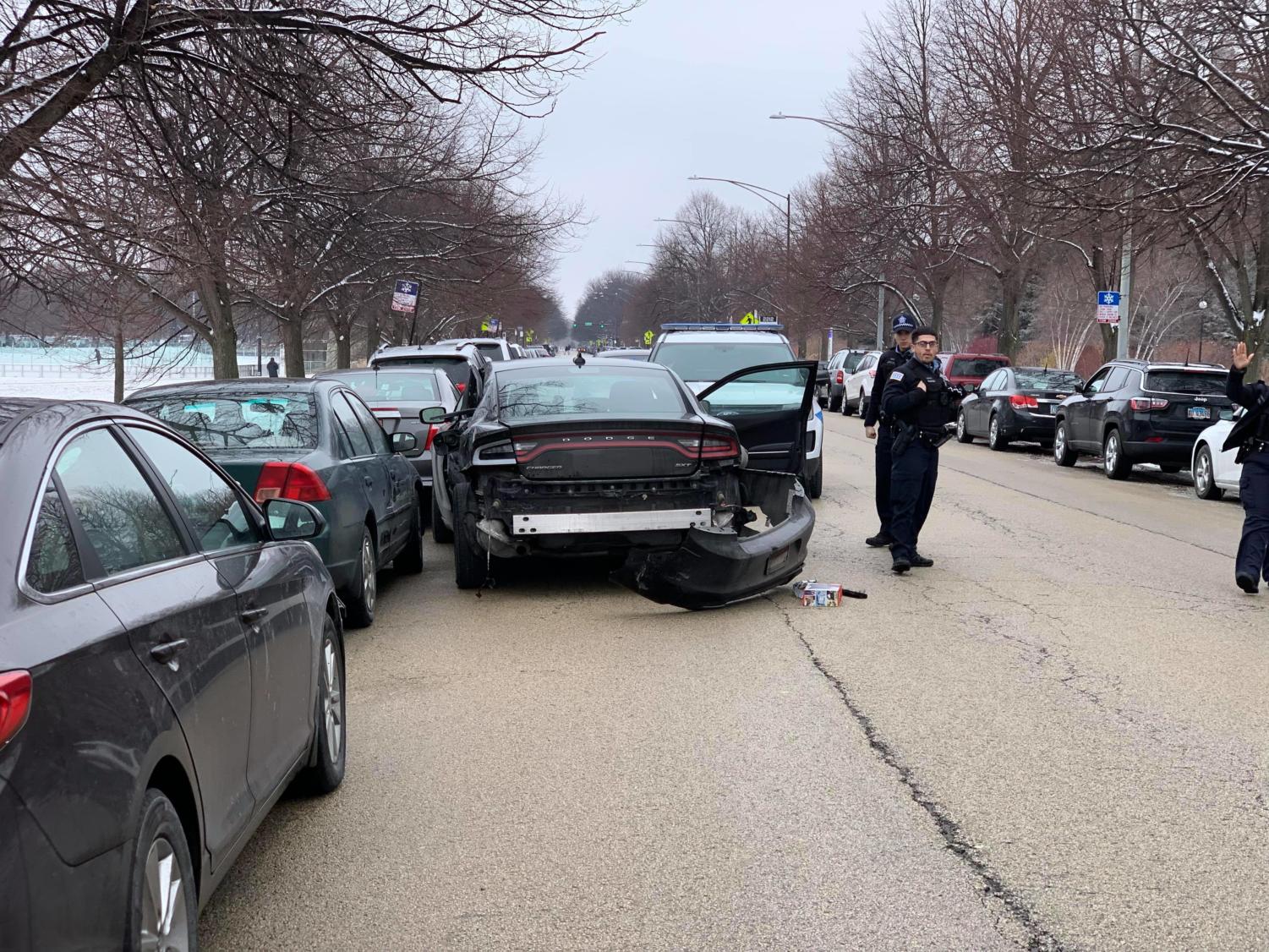 The black Dodge Charger that witnesses say belonged to the suspects was involved in an accident near the intersection of South Woodlawn Avenue and the Midway Plaisance.