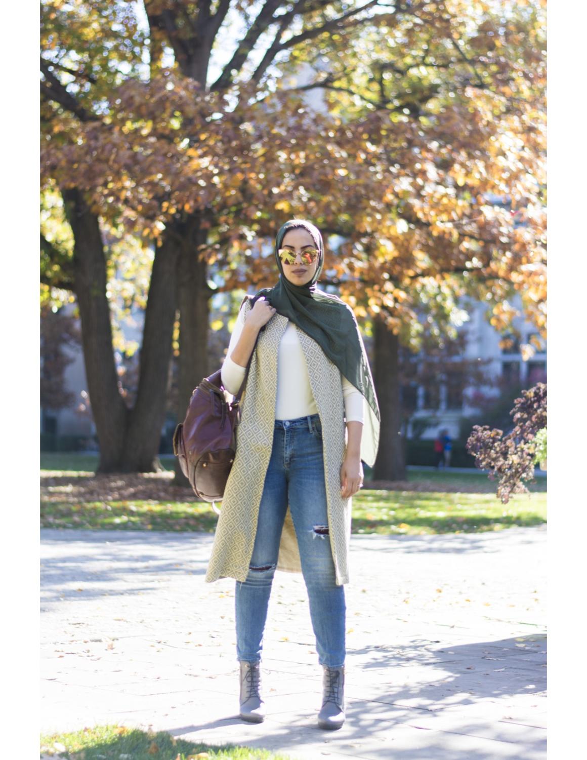 WEARING: Jeans by Gap, vest by Hijab House, gray booties by Salamander, sunglasses by Asos, green scarf courtesy of her sister’s closet