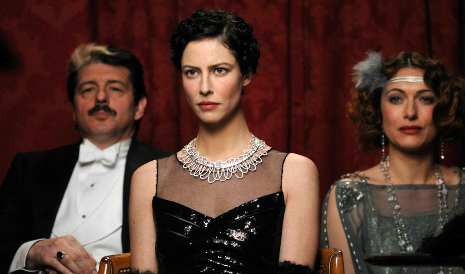 Anna Mouglalis as Coco Chanel, wearing the gown Chanel made famous. 
