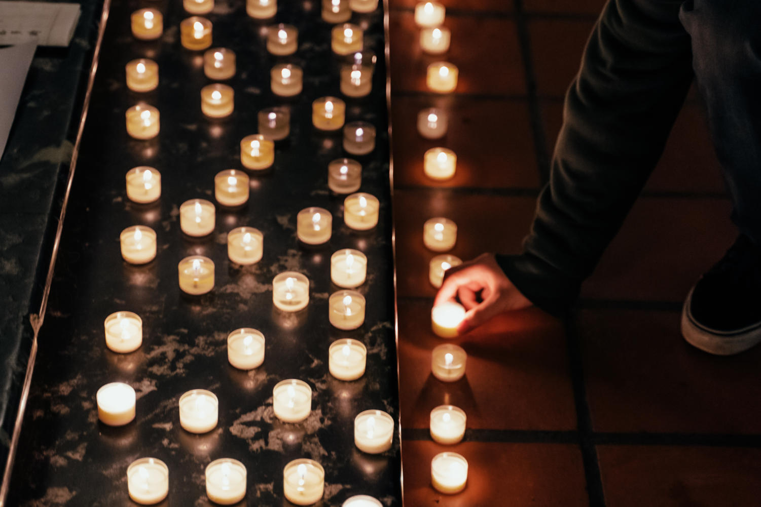 Participants lighted candles at the vigil.