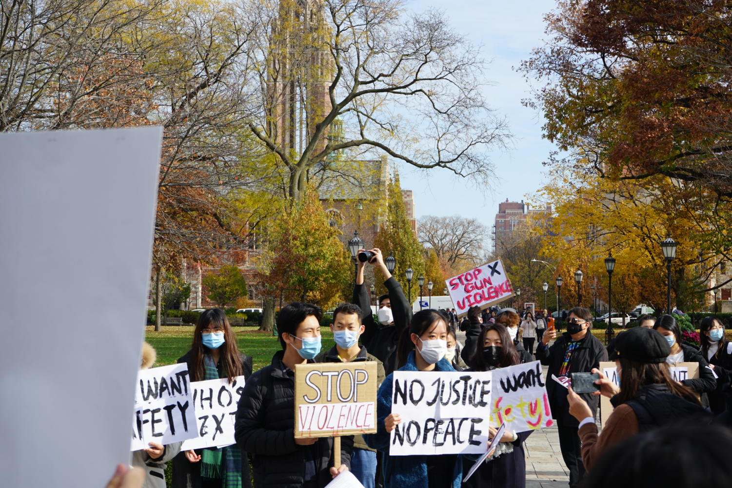 Attendees' signs drew criticism for appropriating racial justice slogans.