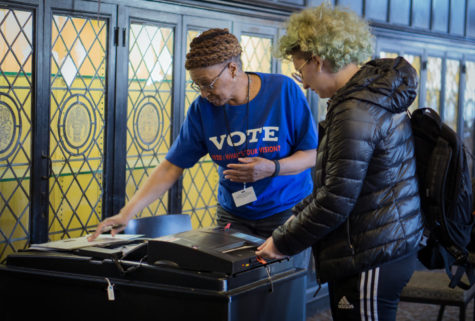 Voter submits their ballot during the 2022 midterm elections.