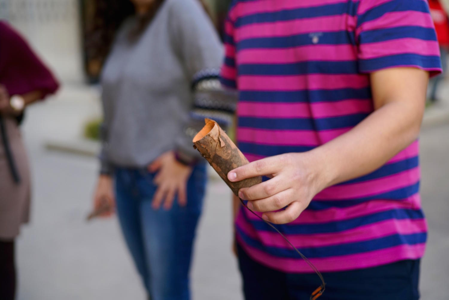 Students find shells with remaining paint on the ground in front of Regenstein Library.