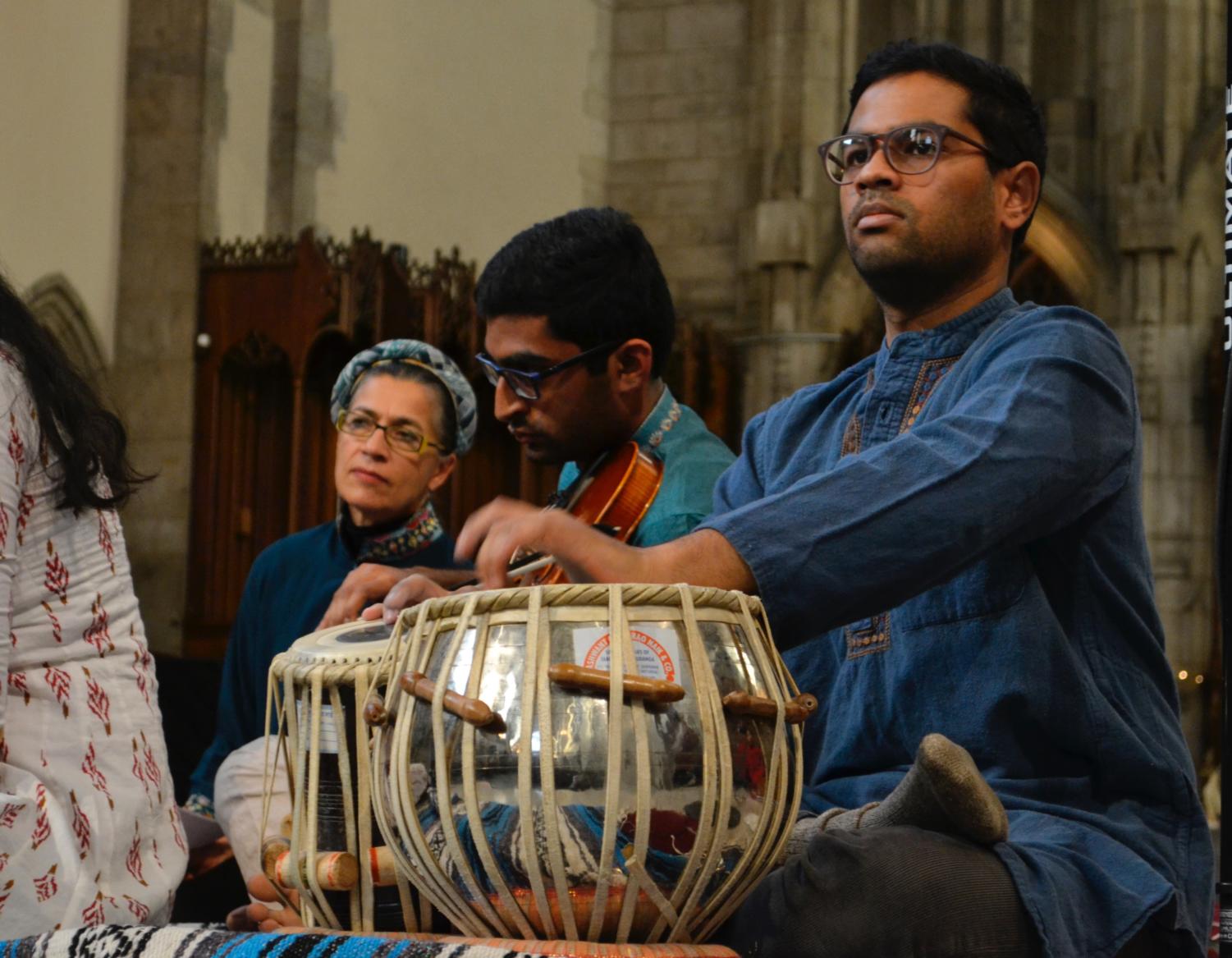 A member of the South Asian Musical Ensemble plays the tabla, a percussion instrument used in Hindustani classical music.