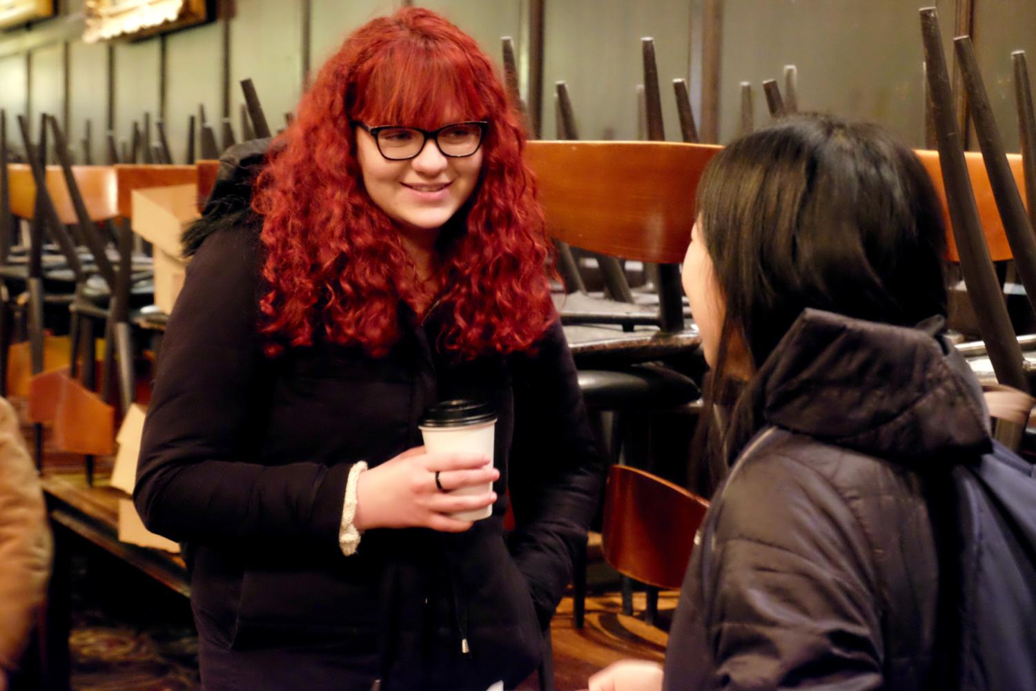 Students drink coffee at the event.