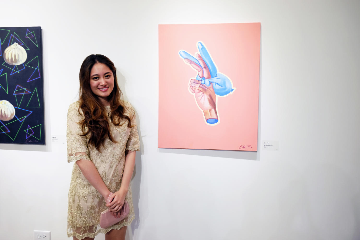 SAIC student Ellen Ma stands with her work at the opening reception of 