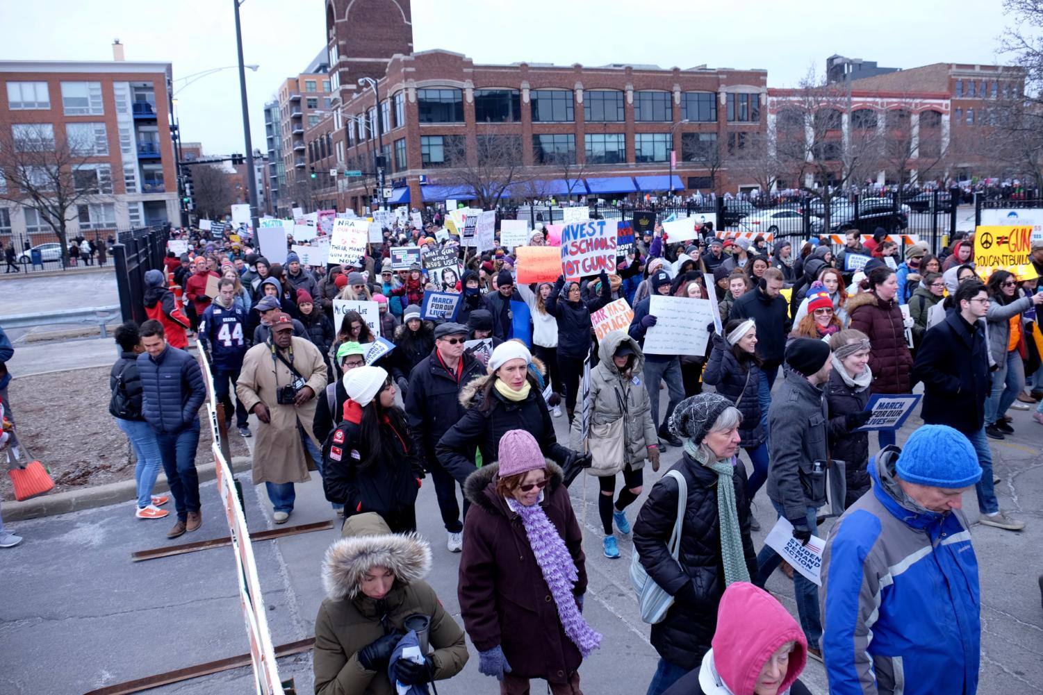 Thousands of protesters march through West Town.
