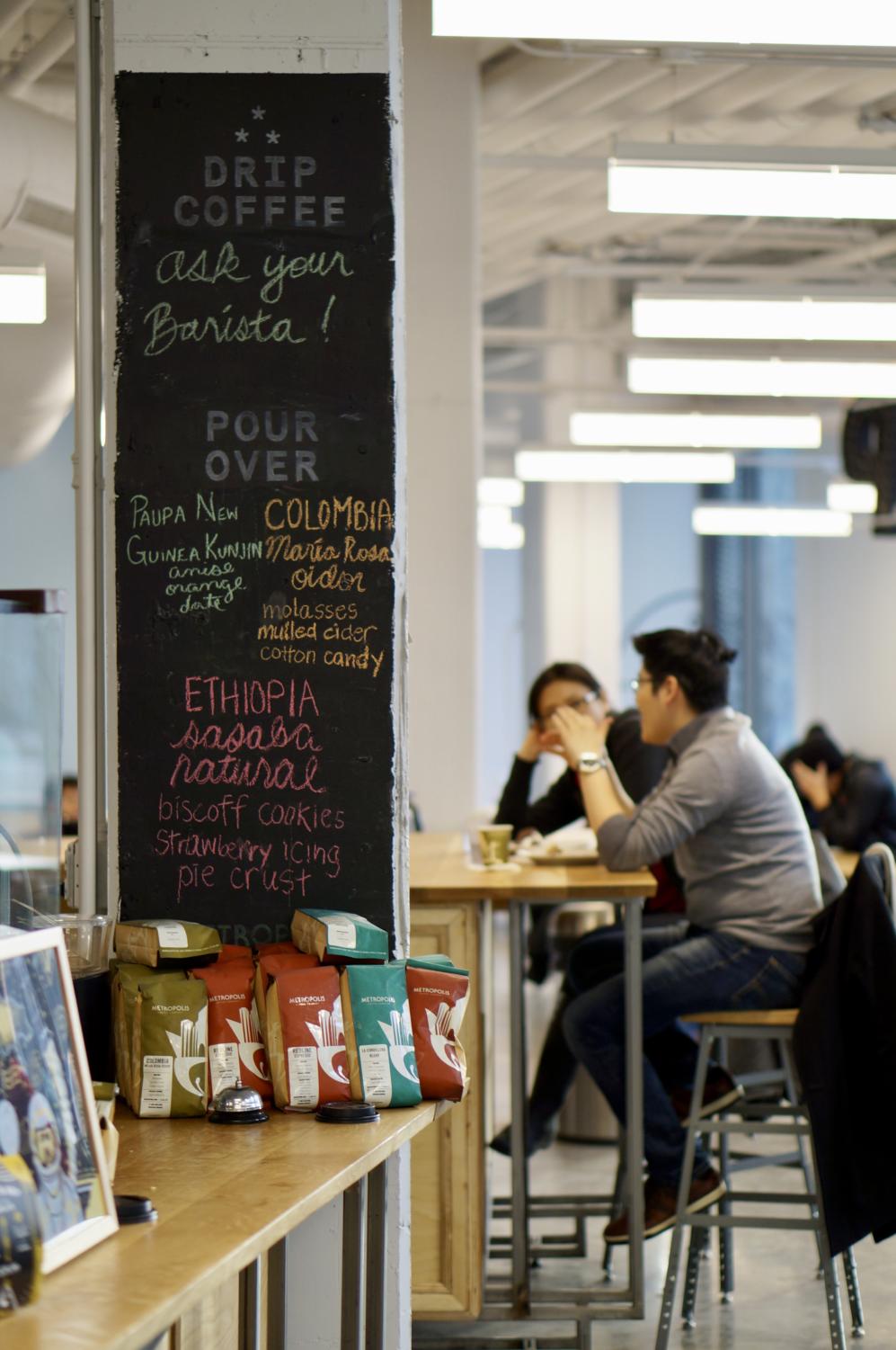 Customers enjoy coffee and snacks at Dollop.