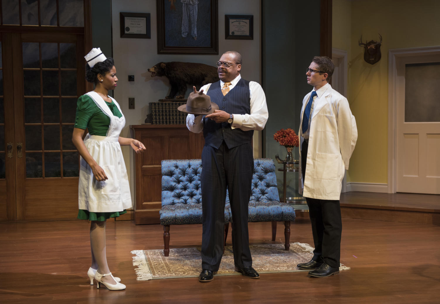 Nurse Miss Kelly (Jennifer Latimore), psychiatrist Dr. Chumley (A.C. Smith), and Dr. Sanderson (Erik Hellamn) discover what might be Harvey's hat.