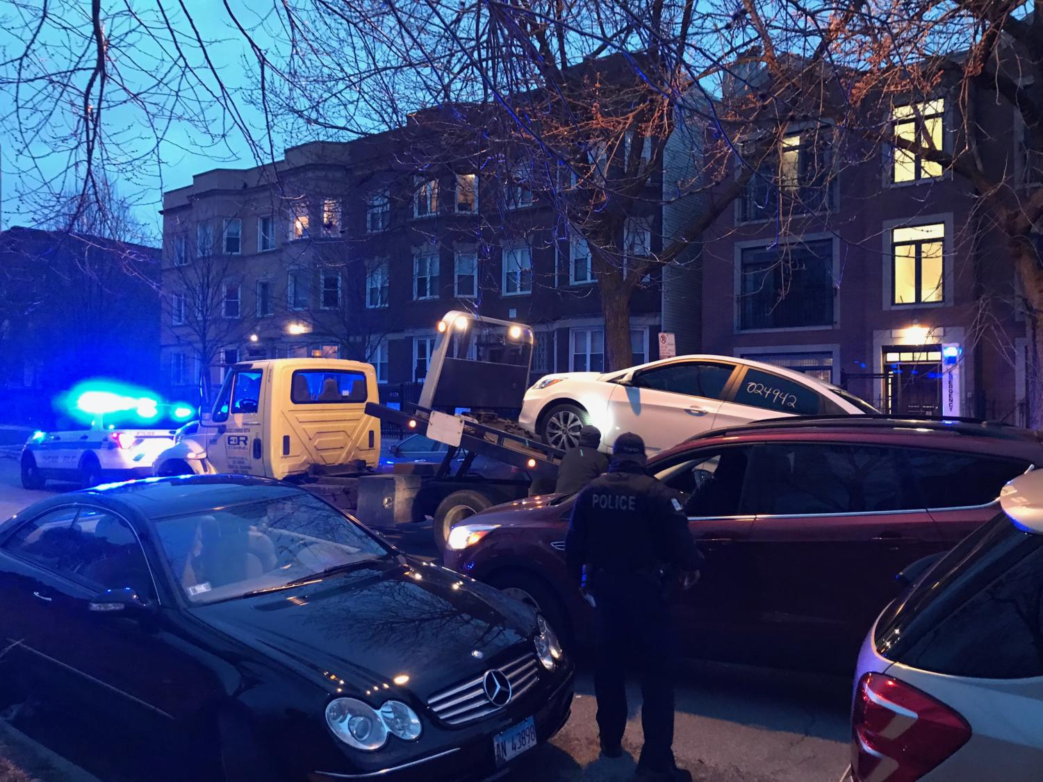 CPD tow a white Hyundai from the scene of Tuesday's shooting. One witness said that after being shot, the victim took something from the car, before self-transporting to the hospital.