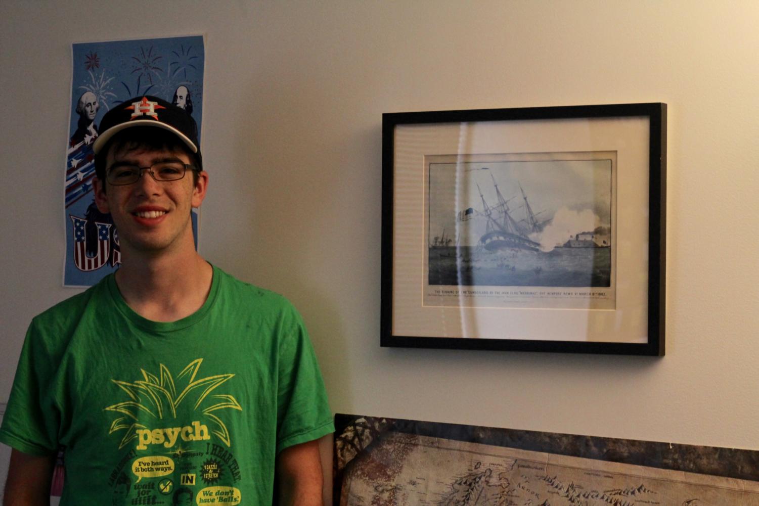 First-year Anthony Brooks with “The Sinking of the Cumberlandby the Ironclad Merrimack” by Currier and Ives