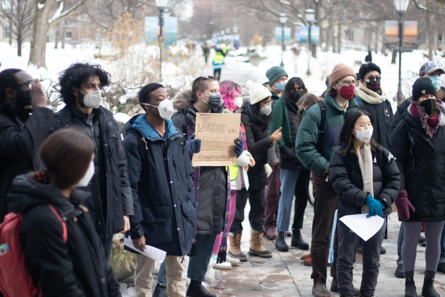 Protesters stand outside Levi Hall during a rally organized by #CareNotCops on Friday, February 4.