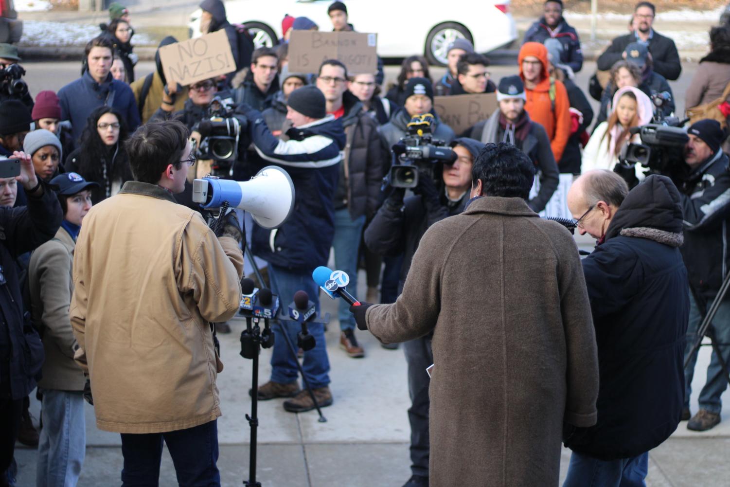 About 100 protesters were demonstrating outside Booth at 8:50 a.m.