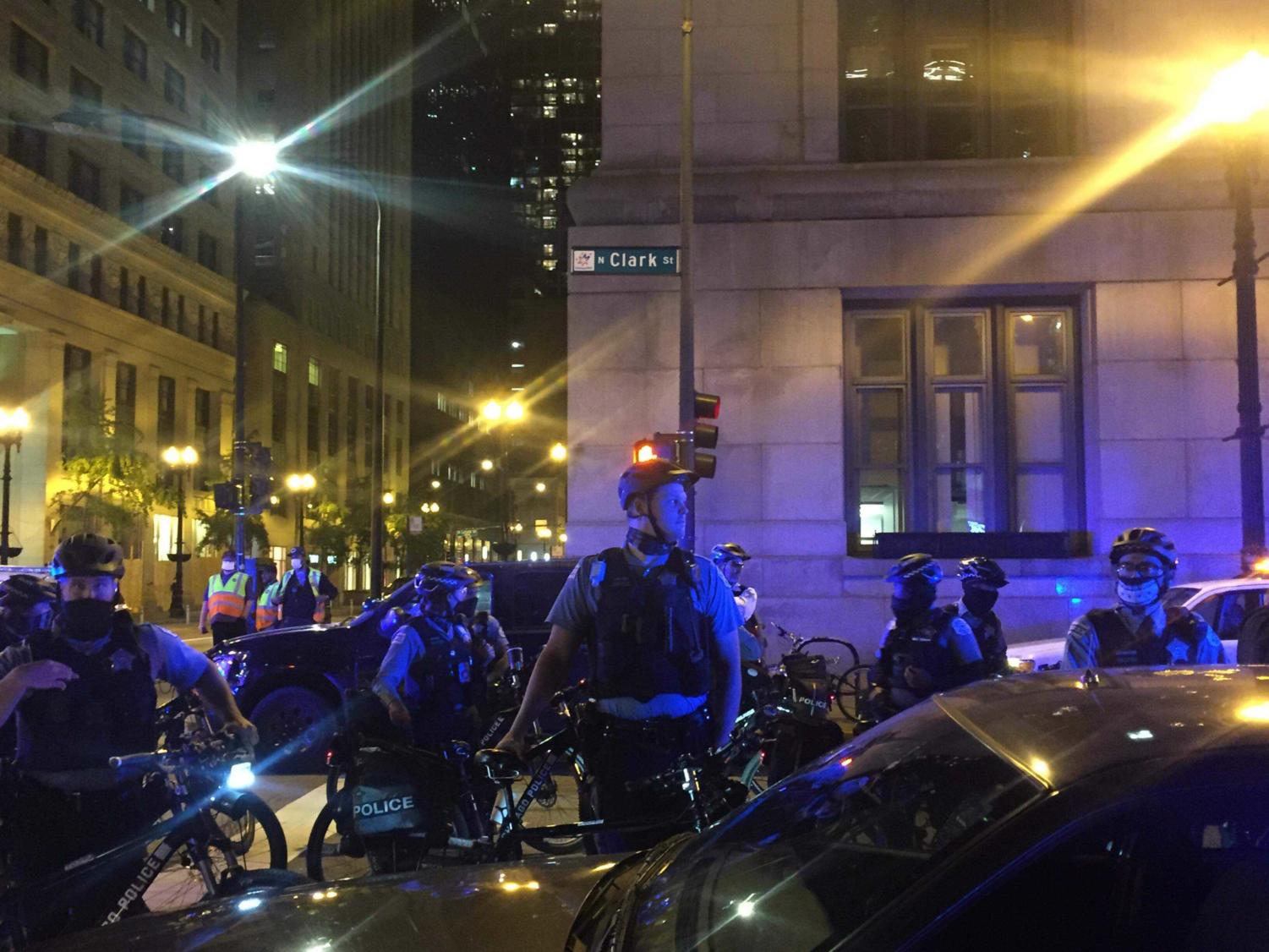 A group of bicycle police officers form a wall during the 'Defend the Election' rally.