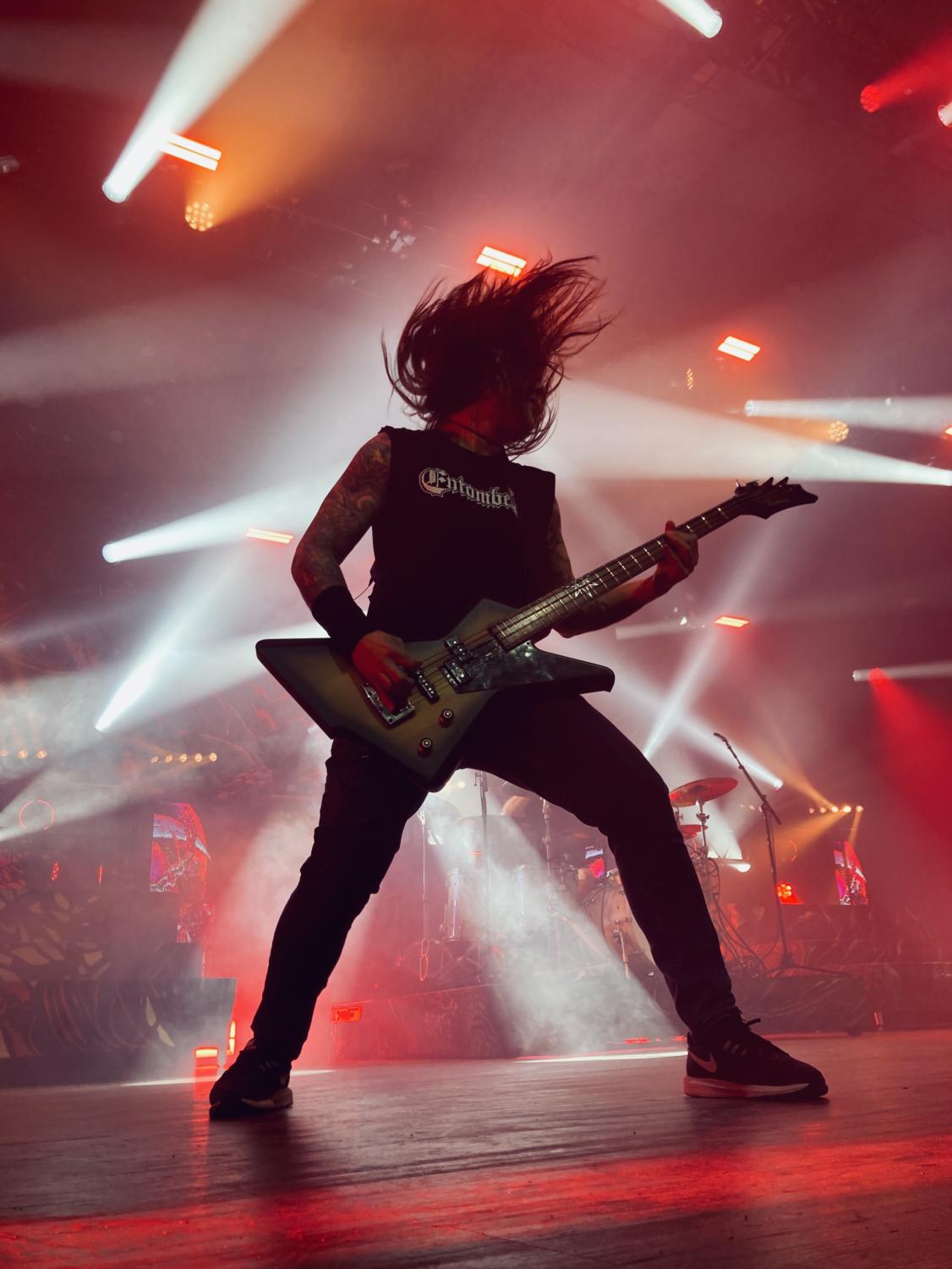 Killswitch Engage bassist Mike D'Antonio's hair flies as he plays.