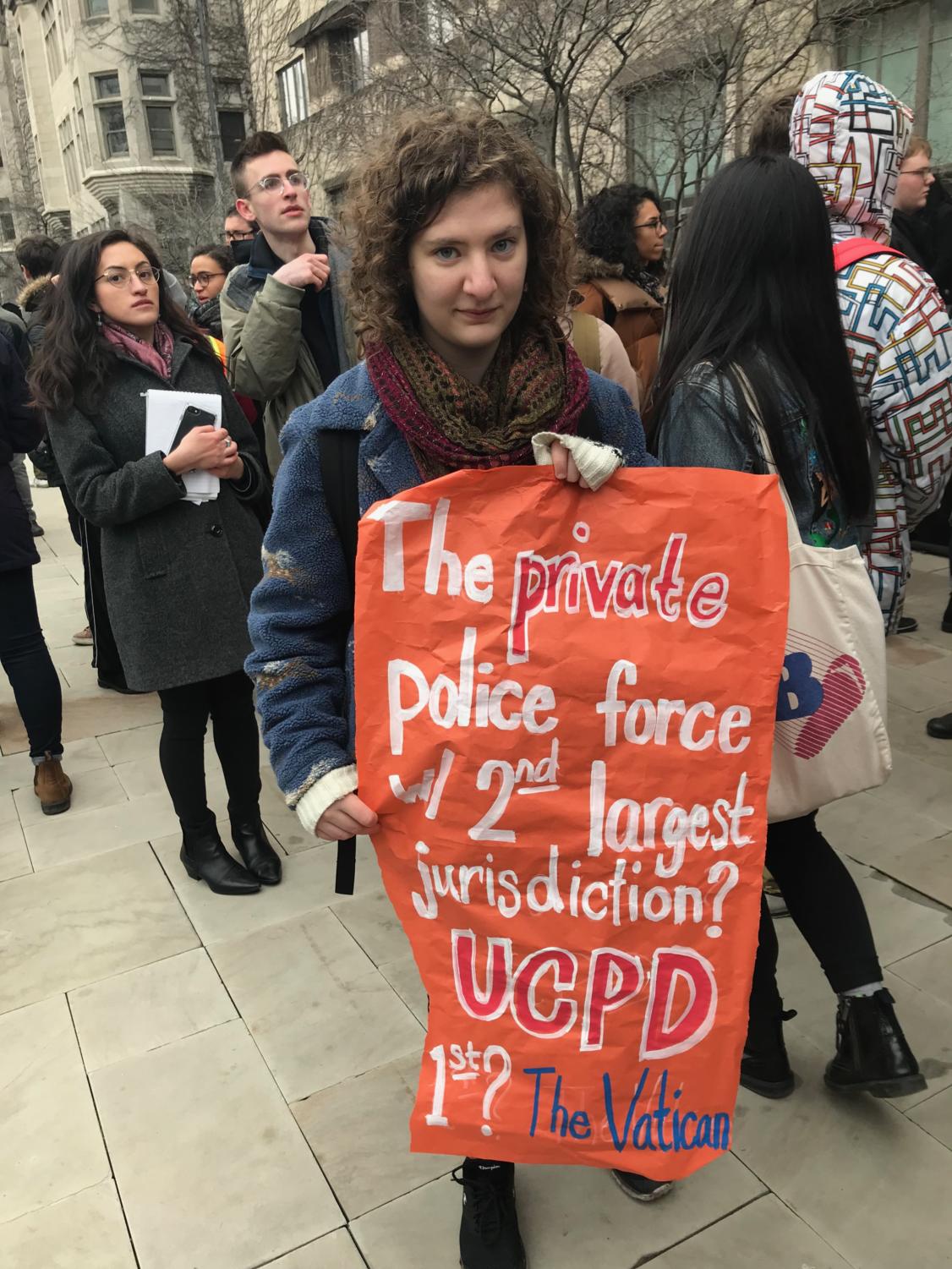 Fourth-year Maya Shaked protests the shooting of Charles Thomas, holding a sign that reads: 