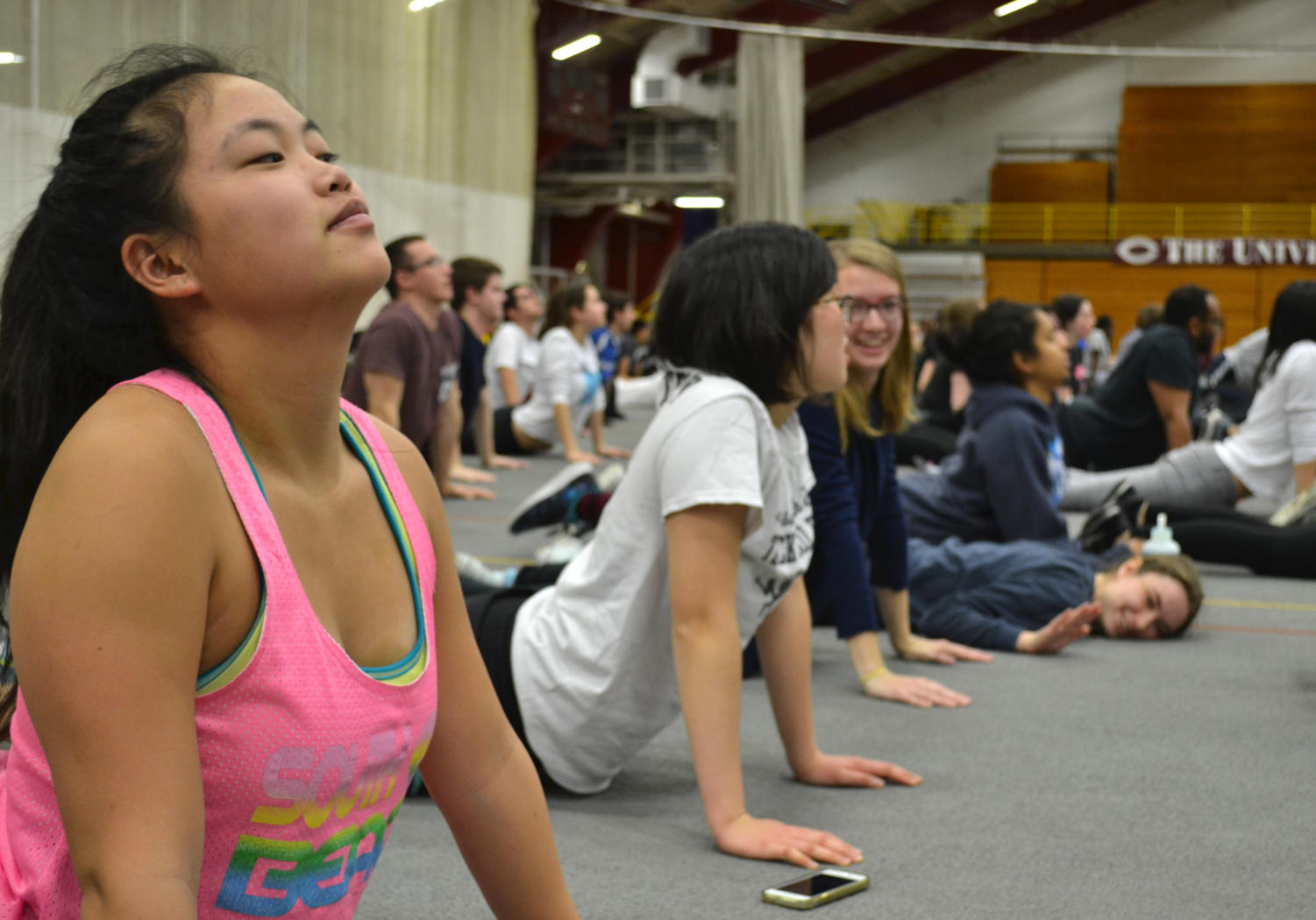 First-year Anna Zipp performs the seal pose with housemates and fellow Kuvia-goers.