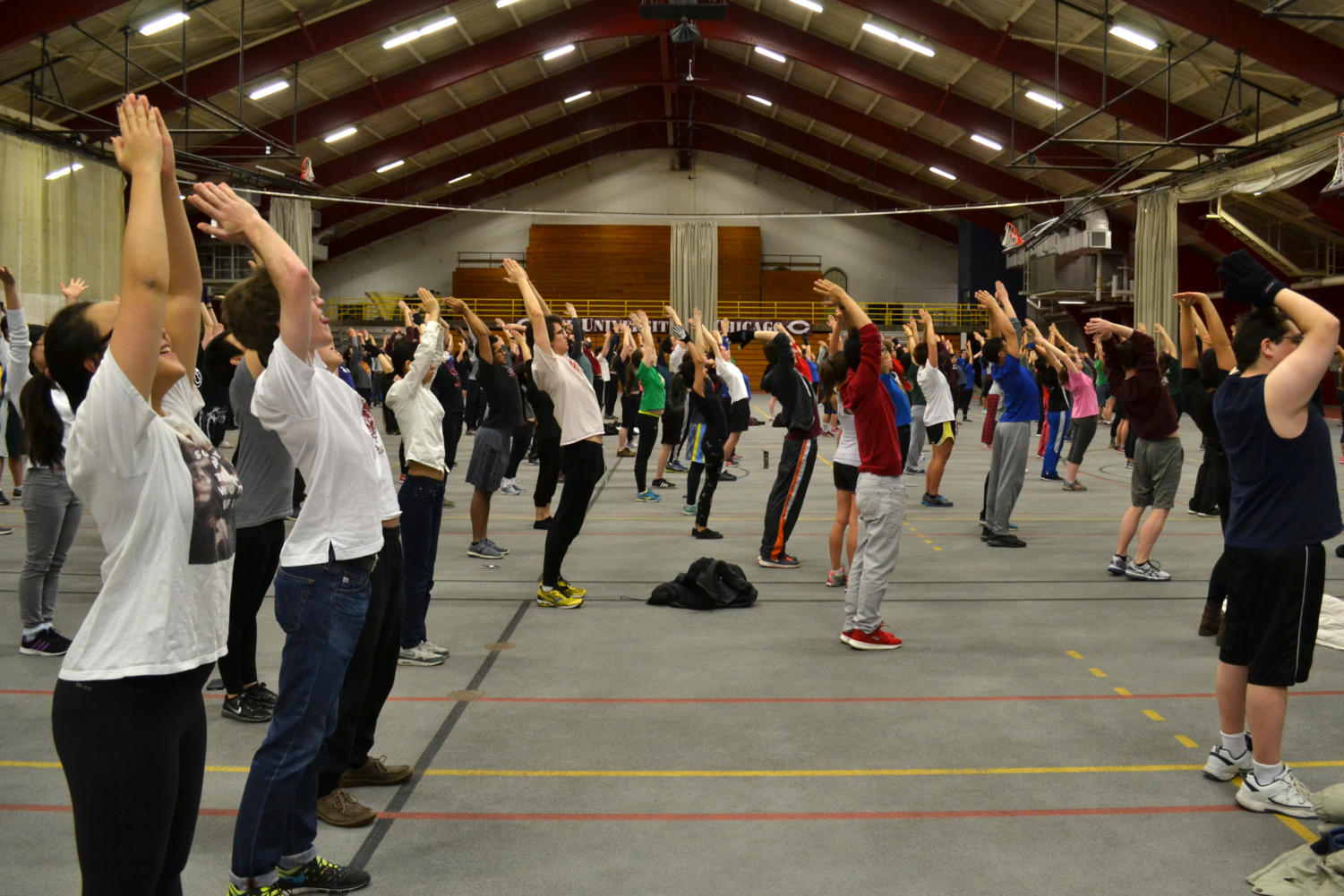 Students stretch in unison.