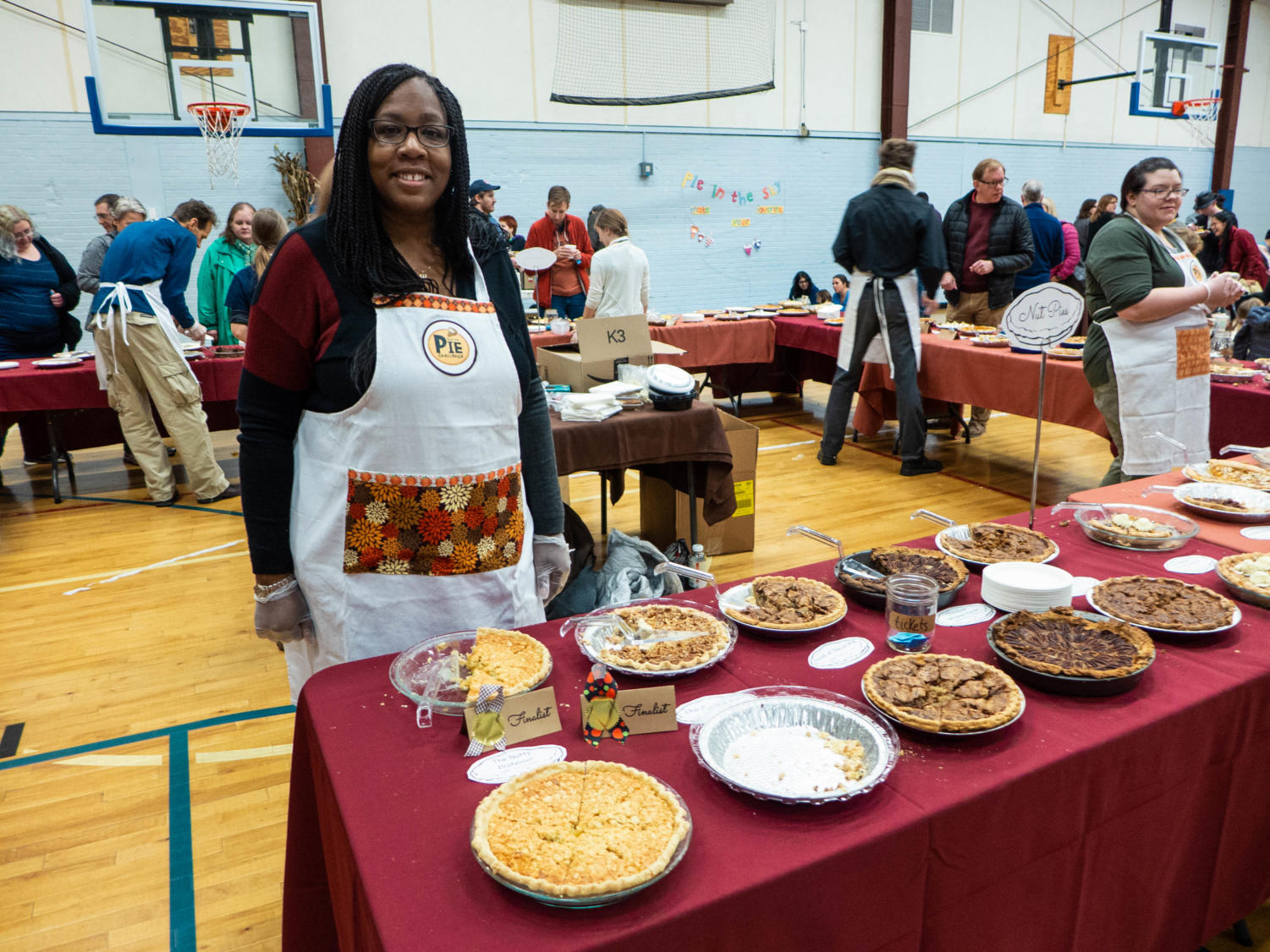 Iheoma Okeke-Banks stands by the nut pie section. Okeke-Banks volunteers for this event every year.