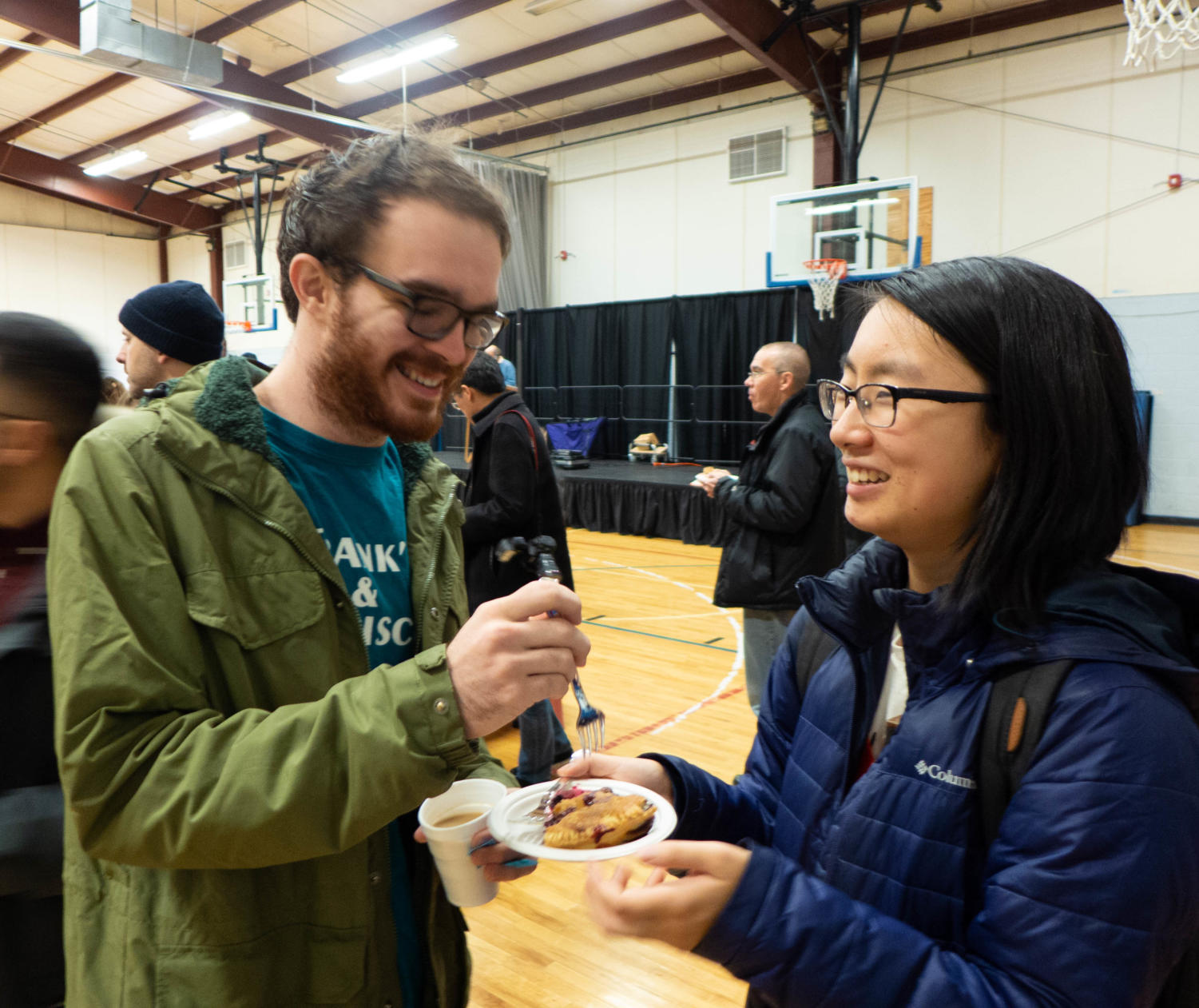 Mickey Cronin, left, and Julie Wu share a slice of pie. The two attended the event to celebrate Cronin’s upcoming birthday.