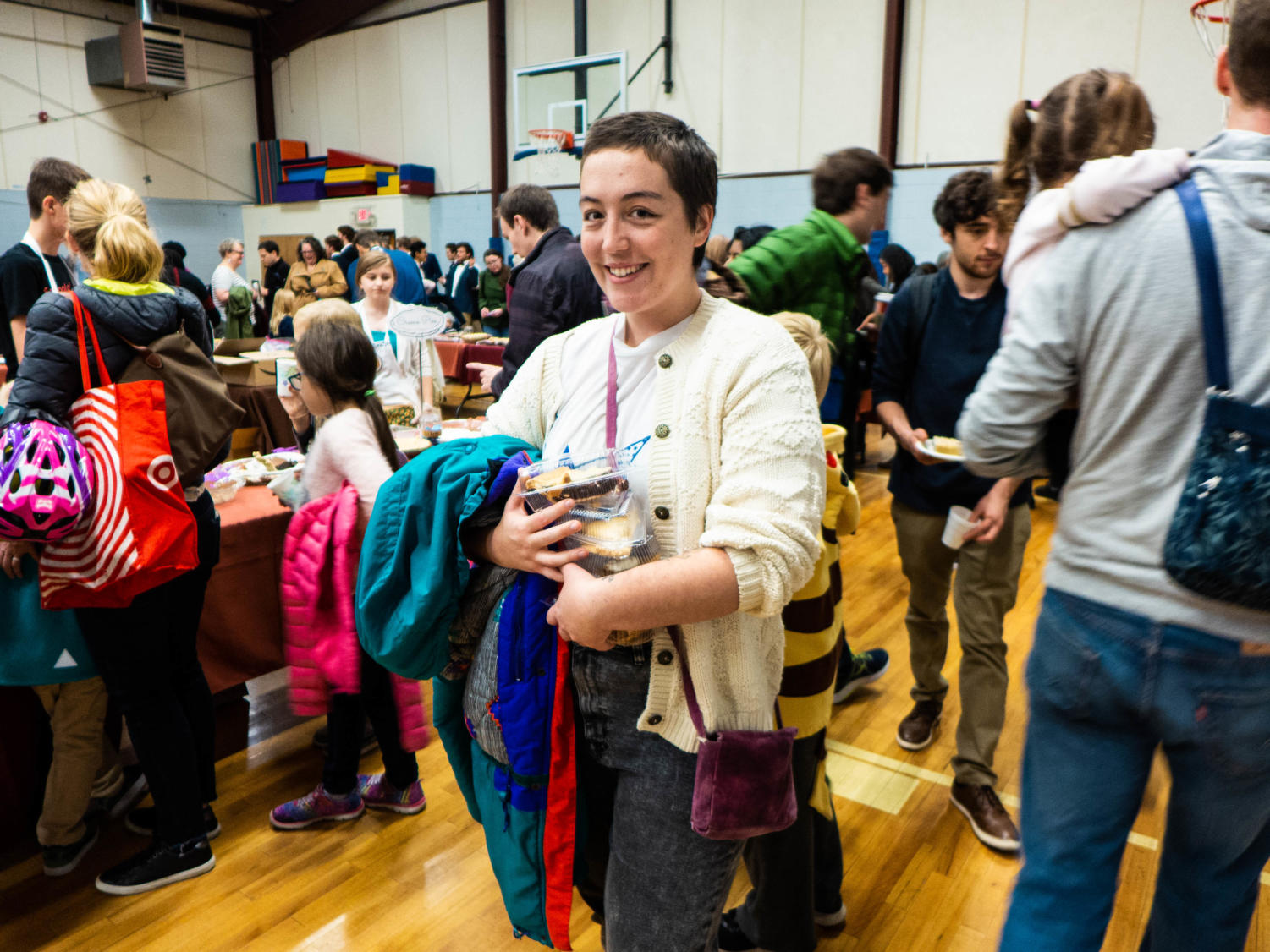 Gray Moreau poses with her boxed up slices of pie. Moreau attended this event with the other residents of her housing co-op.