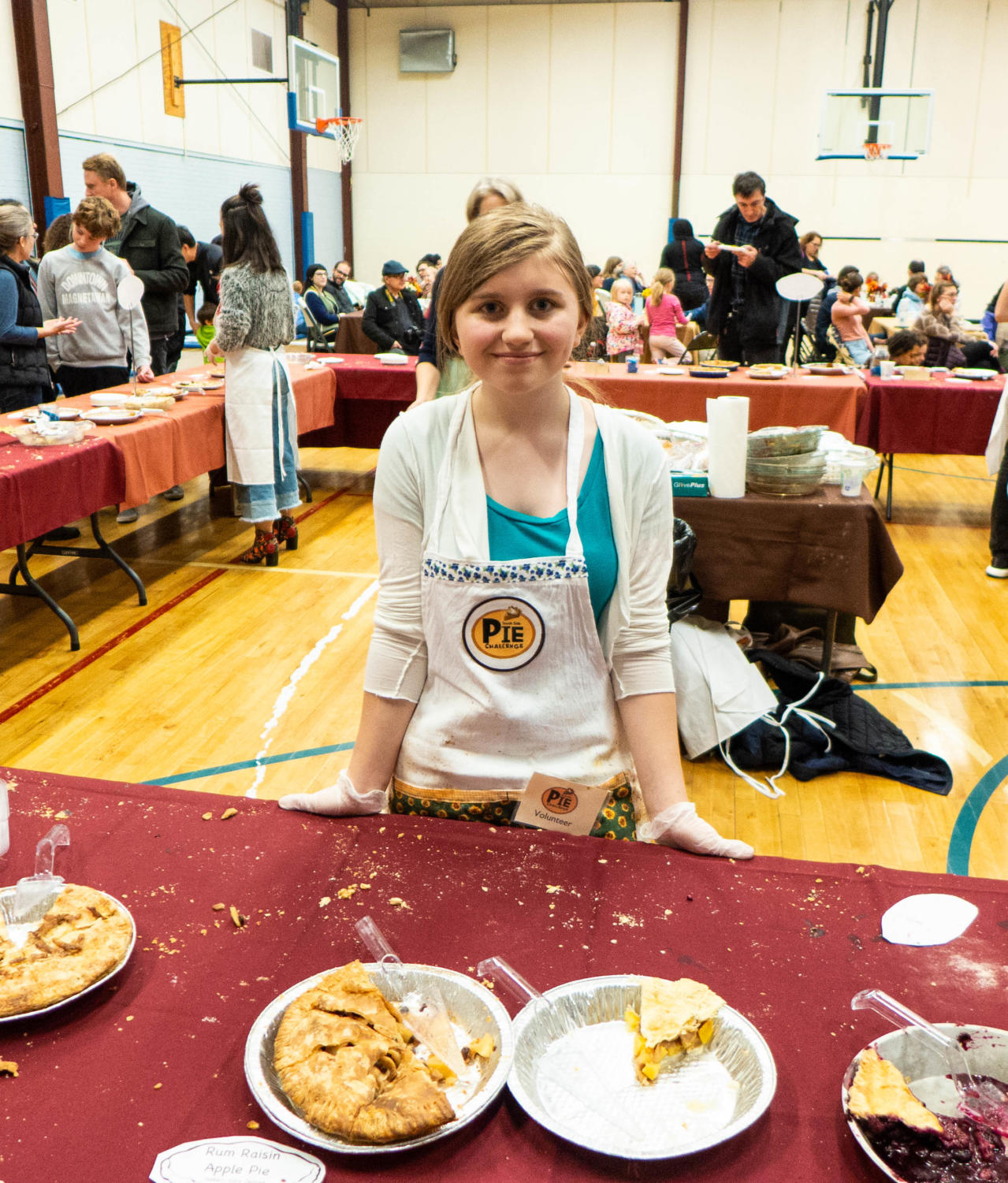 Ruth Andrews, whose key lime pie “The Lime Pie” placed first in the creme pie category, prepares to pass out more pies shortly after accepting her prize. This is her fifth year submitting a pie.