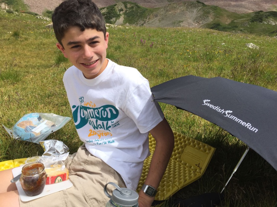 Lewis circa 2015 on a family hiking trip from Aspen to Crested Butte. Unlike the rest of his family who ate “camping food,” Lewis ate “goat cheese, figs, bread, and crackers,” his mother said.