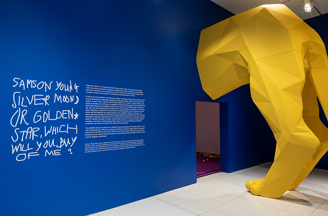 Visitors to Samson Young's solo exhibition at the Smart Museum must first get past a giant lion's hind legs.