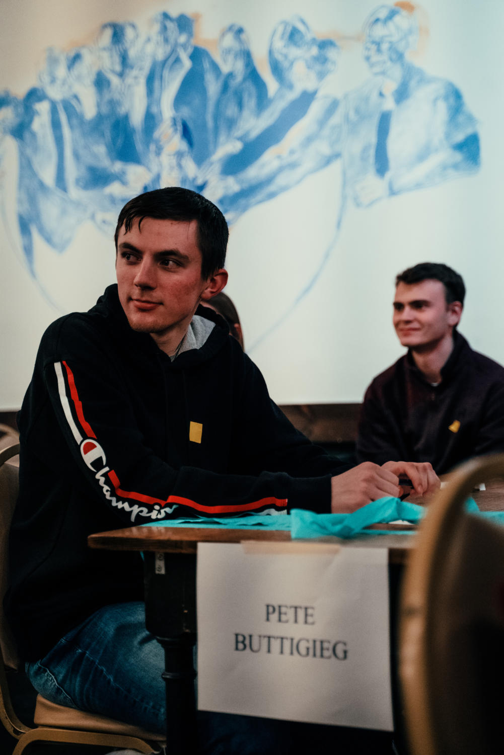 Participants at the table for Pete Buttigieg at the Iowa satellite caucus.