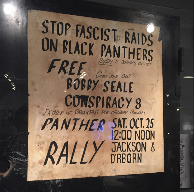 The “STOP FASCIST RAIDS” poster and the bullet-riddled door on which it is mounted are potent reminders of Chicago’s history of racial unrest.